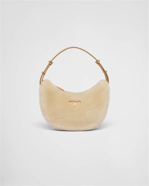 prada arque shearling bag|Prada Arqué Shearling And Leather Shoulder Bag.